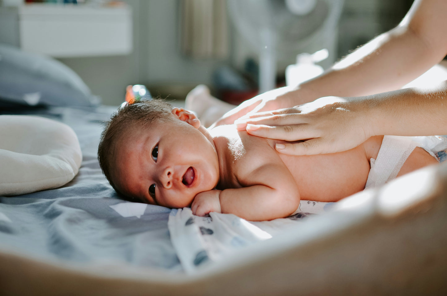 A nurturing newborn massage helps calm babies, relieve gas, improve sleep, and promote bonding in a peaceful environment