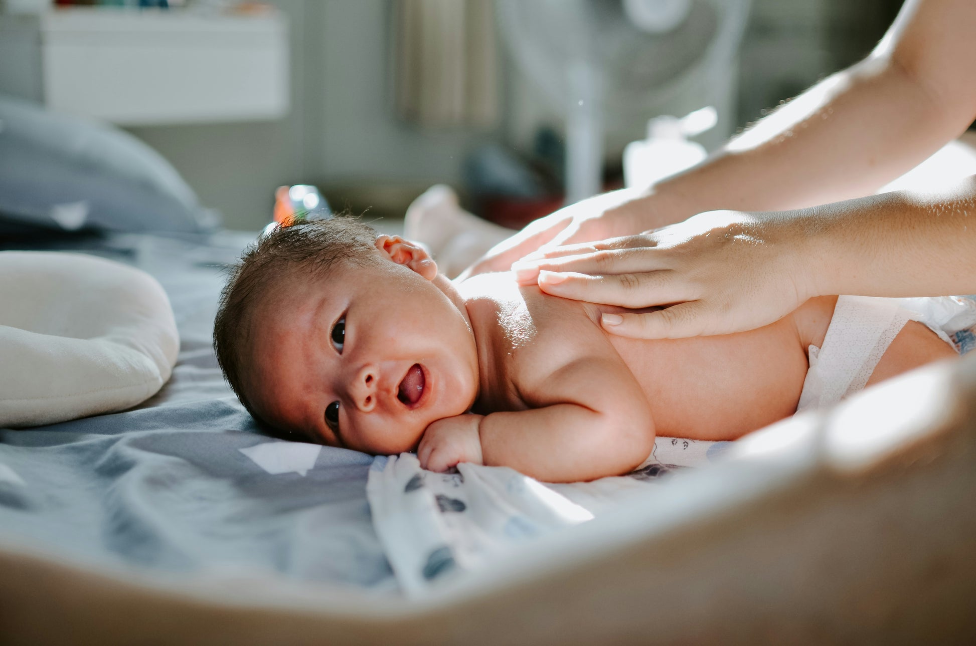 A nurturing newborn massage helps calm babies, relieve gas, improve sleep, and promote bonding in a peaceful environment